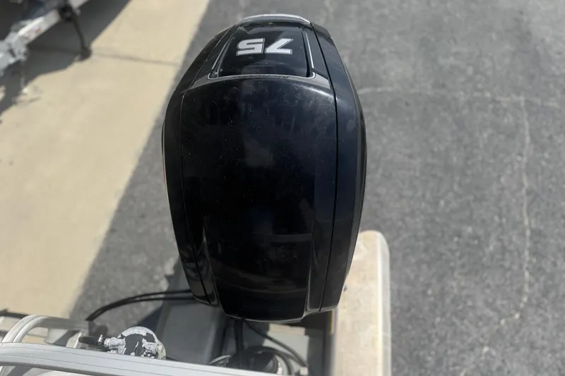 Slide: The Image of Close-up of a 75 HP outboard motor on a 2017 Sun Tracker Bass Buggy 18 DLX. - 18