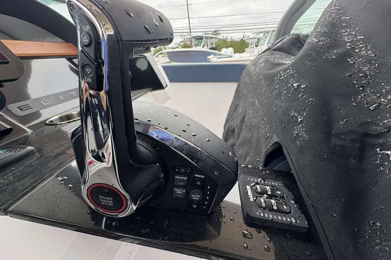 Slide: The Image of Close-up of 2026 Monterey 27 Elite boat controls with water droplets. - 12