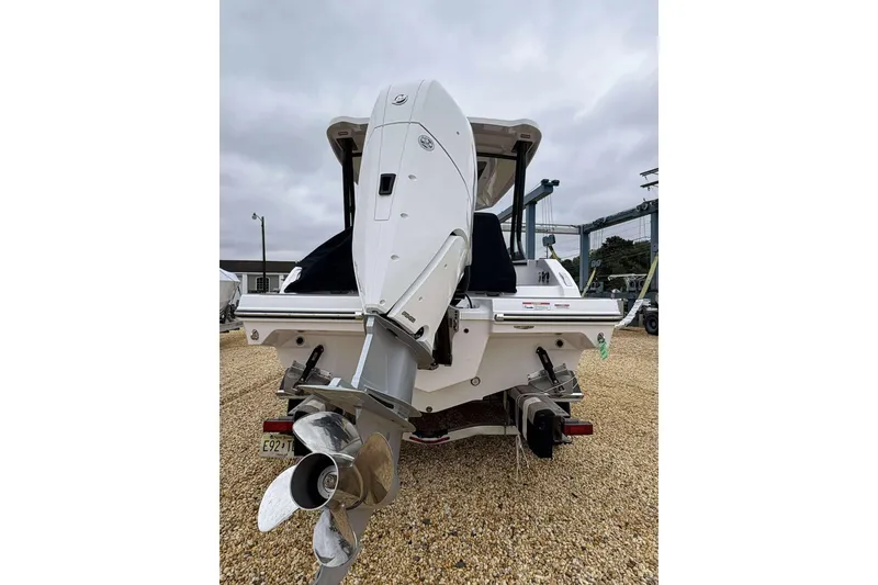 Slide: The Image of 2026 Monterey 27 Elite boat rear view with powerful outboard motor. - 15