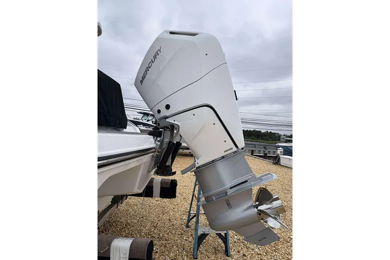 Slide: The Image of 2026 Monterey 27 Elite boat with Mercury outboard motor on display. - 16