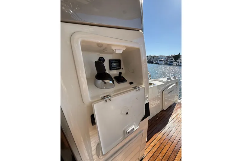 Slide: The Image of 2016 Prestige 500 yacht control panel with joystick, dockside view. - 11