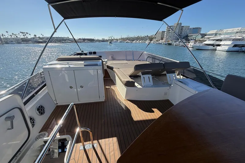 Slide: The Image of Luxurious 2016 Prestige 500 yacht deck with seating, overlooking marina and waterfront views. - 20