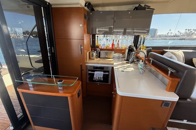 Slide: The Image of Luxurious kitchen interior of a 2016 Prestige 500 yacht with modern amenities and ocean view. - 25
