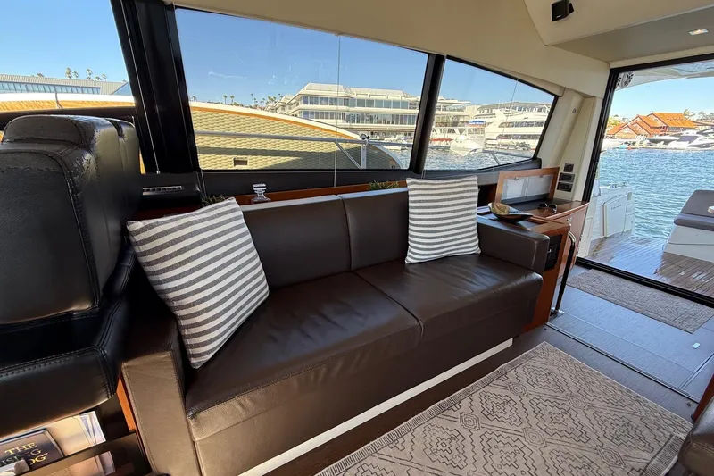 Slide: The Image of Luxurious interior of 2016 Prestige 500 yacht with leather seating and striped cushions. - 28