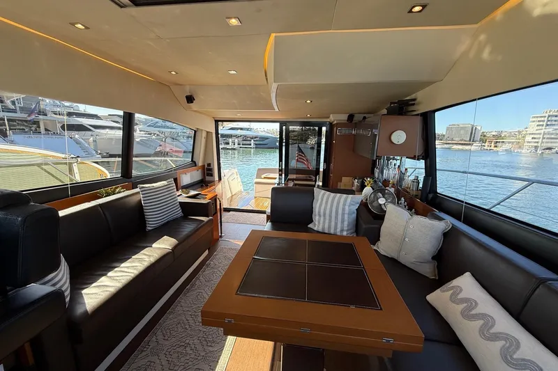 Slide: The Image of Luxurious interior of a 2016 Prestige 500 yacht with elegant seating and waterfront view. - 32