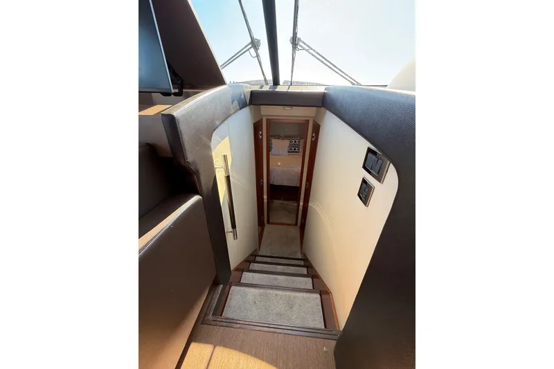 Slide: The Image of Staircase leading to cabin interior of 2016 Prestige 500 yacht. - 33