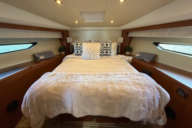 Slide: The Image of Luxurious bedroom interior of 2016 Prestige 500 yacht with plush bedding and modern decor. - 34