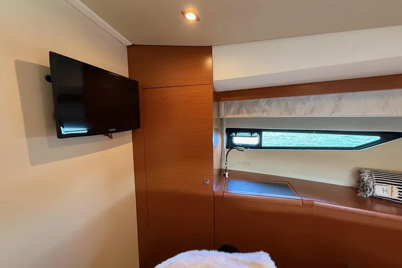 Slide: The Image of Interior of 2016 Prestige 500 yacht with TV and window view. - 35