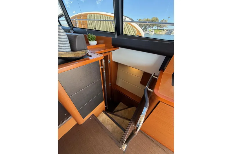 Slide: The Image of Interior of 2016 Prestige 500 yacht showing stairs and wooden cabinetry. - 41