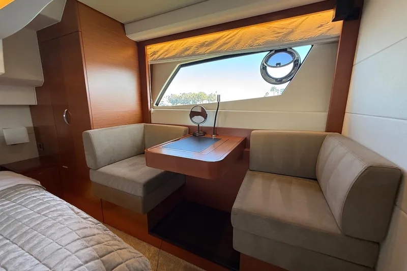 Slide: The Image of Luxurious interior of 2016 Prestige 500 yacht with cozy seating and elegant wood finishes. - 43