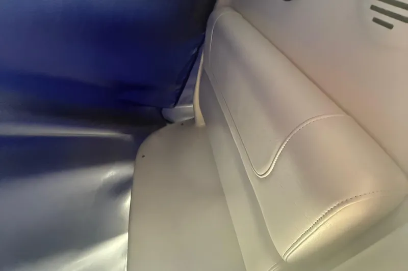 Slide: The Image of Interior seating of 2020 Grady-White Fisherman 257 boat, featuring white upholstery. - 10