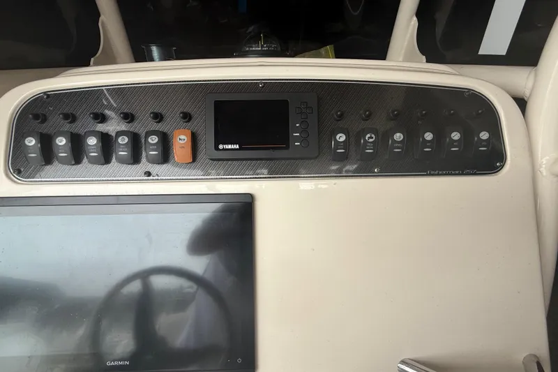 Slide: The Image of Control panel of 2020 Grady-White Fisherman 257 boat with Yamaha display and switches. - 11