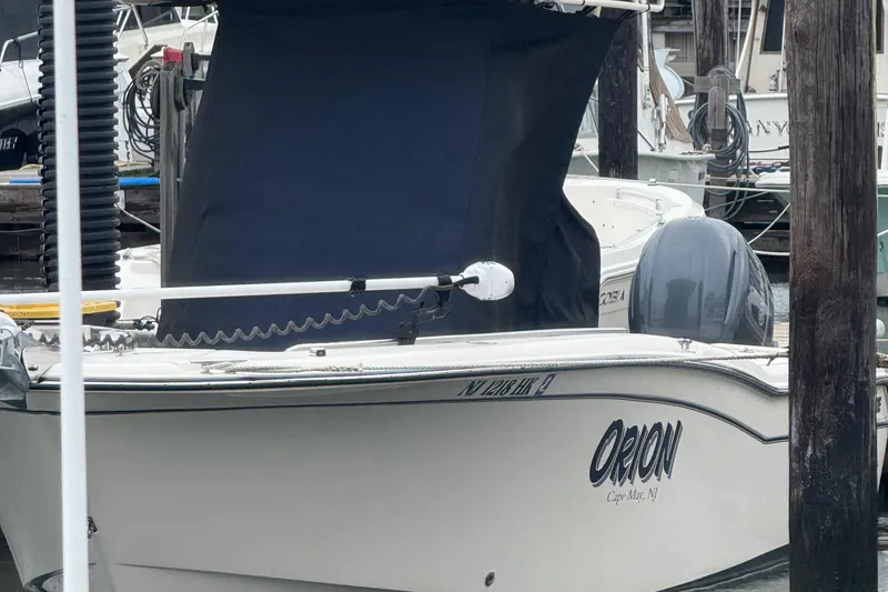 Slide: The Image of 2020 Grady-White Fisherman 257 boat named Orion docked in marina. - 12