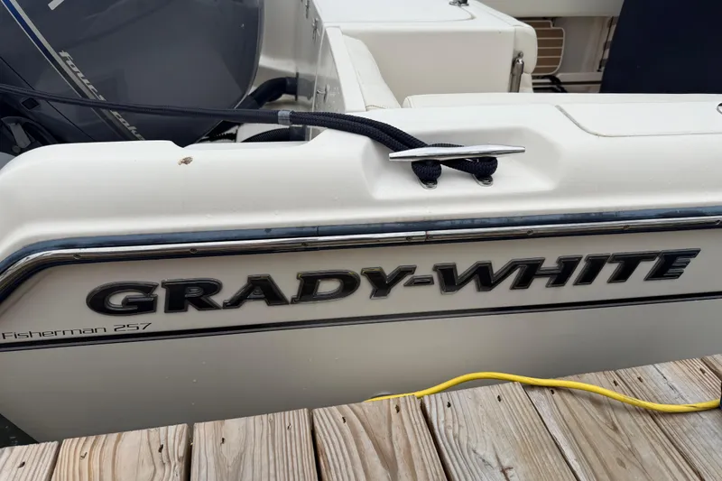 Slide: The Image of 2020 Grady-White Fisherman 257 boat docked, showcasing brand logo and model name. - 15