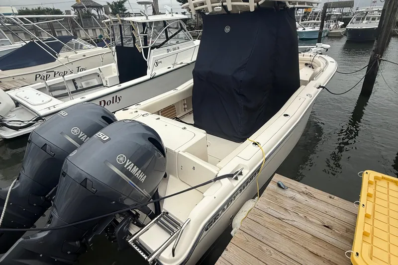 Slide: The Image of 2020 Grady-White Fisherman 257 boat docked with twin Yamaha engines. - 17