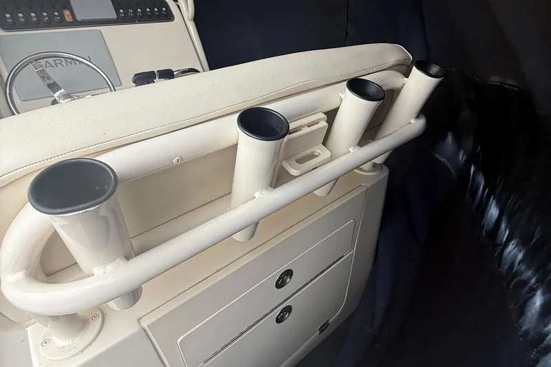 Slide: The Image of 2020 Grady-White Fisherman 257 boat console with rod holders and storage compartments. - 18