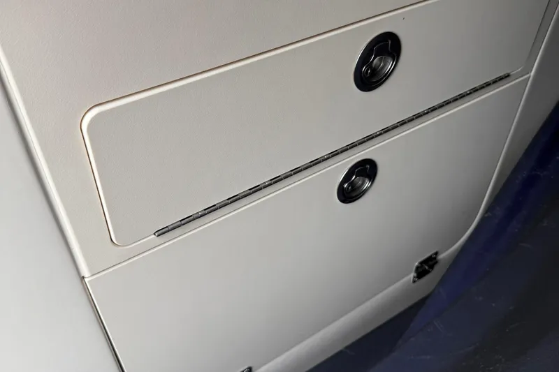 Slide: The Image of 2020 Grady-White Fisherman 257 boat storage compartment with secure latches. - 19