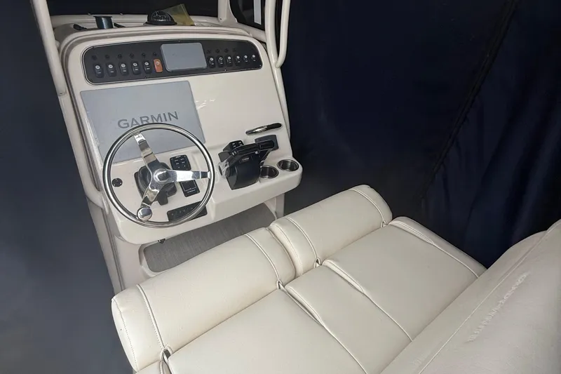 Slide: The Image of 2020 Grady-White Fisherman 257 boat console with Garmin navigation system and steering wheel. - 27