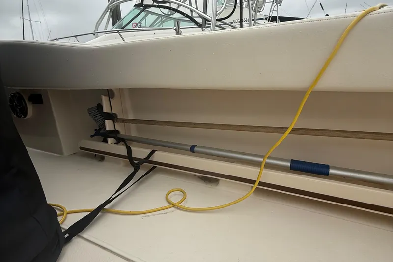 Slide: The Image of 2020 Grady-White Fisherman 257 boat interior with storage compartment and yellow cable. - 30