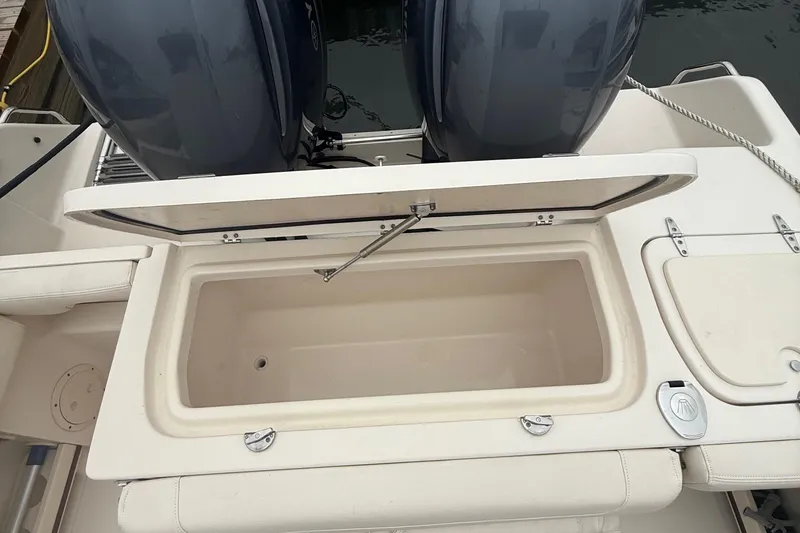Slide: The Image of 2020 Grady-White Fisherman 257 boat with open storage compartment and dual engines. - 34