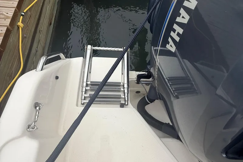 Slide: The Image of 2020 Grady-White Fisherman 257 boat with Yamaha engine and ladder by the dock. - 37