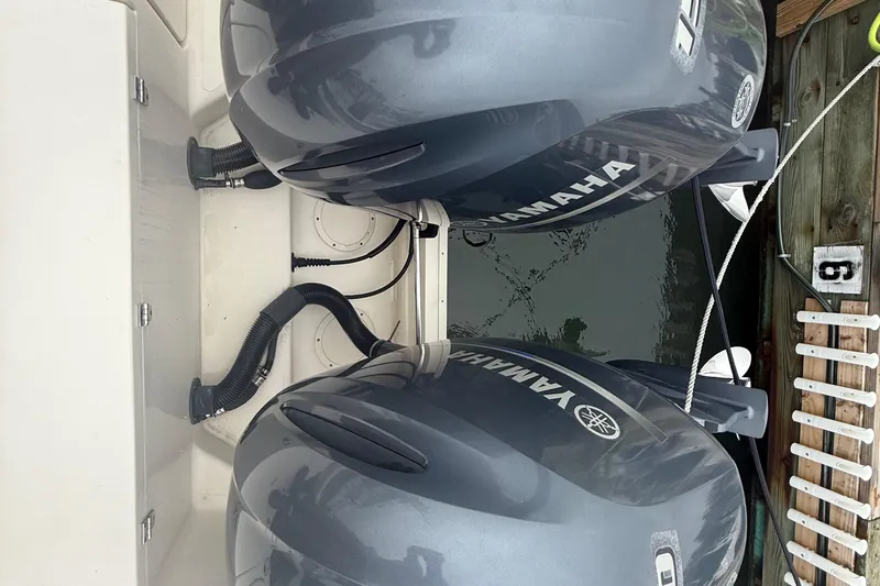 Slide: The Image of Twin Yamaha outboard engines on a 2020 Grady-White Fisherman 257 boat at dock. - 38