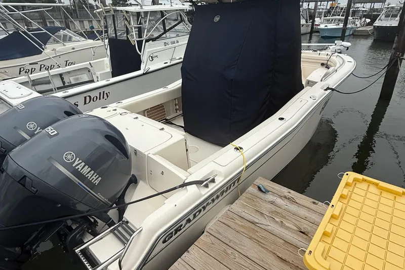 Slide: The Image of 2020 Grady-White Fisherman 257 boat docked with Yamaha engines, covered console. - 4