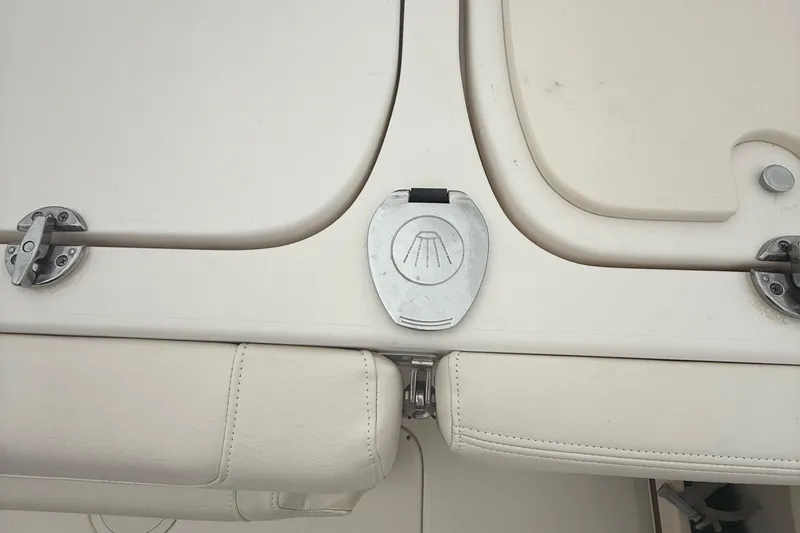 Slide: The Image of 2020 Grady-White Fisherman 257 boat deck with metal latch and cushioned seating. - 40