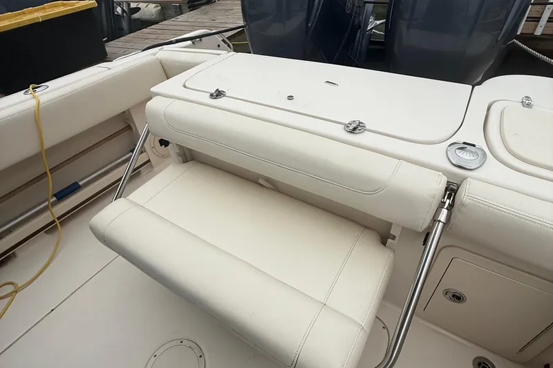 Slide: The Image of 2020 Grady-White Fisherman 257 boat interior with foldable seating and storage compartments. - 42
