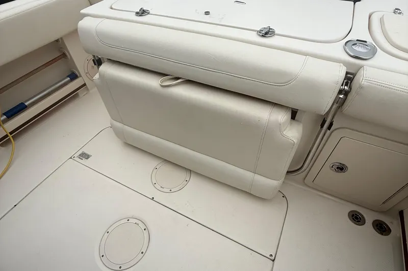 Slide: The Image of 2020 Grady-White Fisherman 257 boat interior with foldable seating and storage compartments. - 43