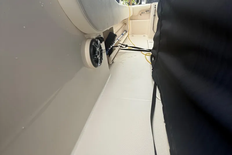 Slide: The Image of Interior view of a 2020 Grady-White Fisherman 257 boat, featuring seating and speaker. - 44