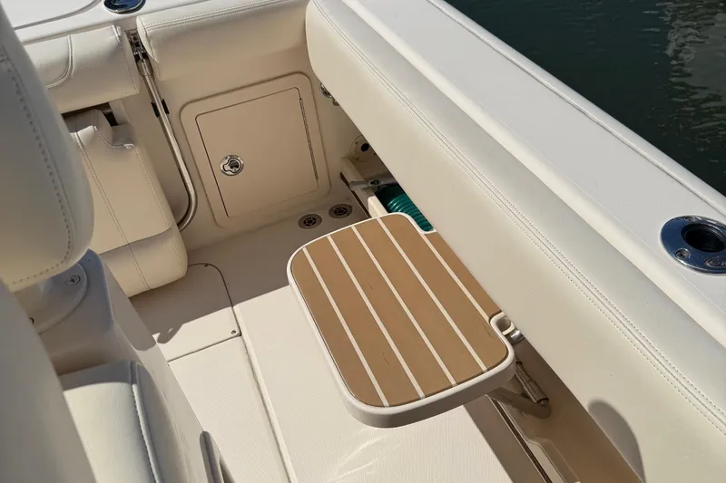 Slide: The Image of 2020 Grady-White Fisherman 257 boat interior with foldable seat and storage compartment. - 61