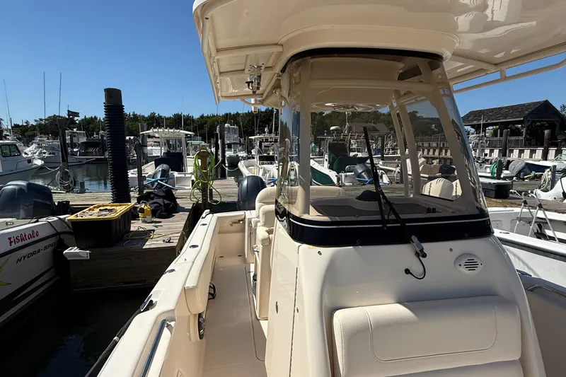 Slide: The Image of 2020 Grady-White Fisherman 257 boat docked at a marina under clear blue skies. - 63