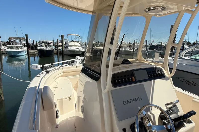 Slide: The Image of 2020 Grady-White Fisherman 257 boat with Garmin navigation, docked in a marina. - 66