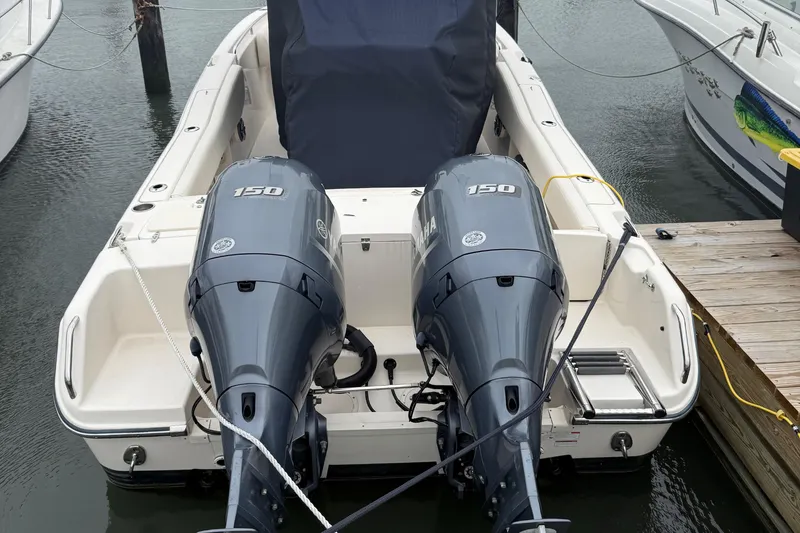 Slide: The Image of 2020 Grady-White Fisherman 257 with dual Yamaha 150 engines docked at marina. - 9