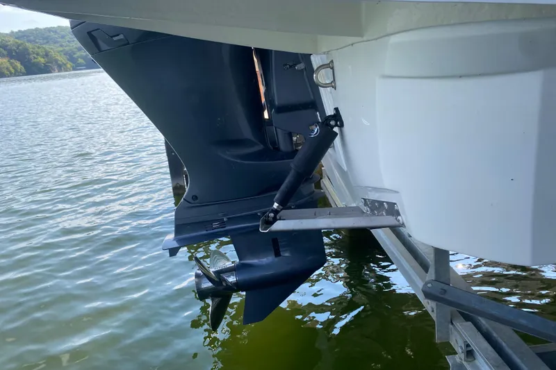Slide: The Image of 2024 Jeanneau NC 895 outboard motor on calm water. - 10