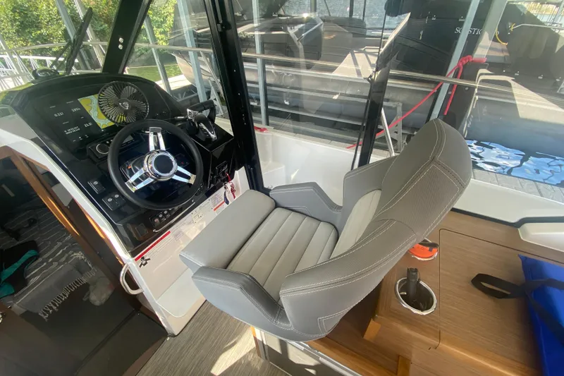 Slide: The Image of 2024 Jeanneau NC 895 helm station with modern steering and comfortable seating. - 24