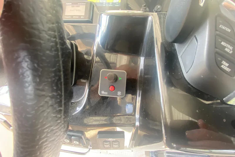 Slide: The Image of 2024 Jeanneau NC 895 helm controls with steering wheel and electronic panel. - 30