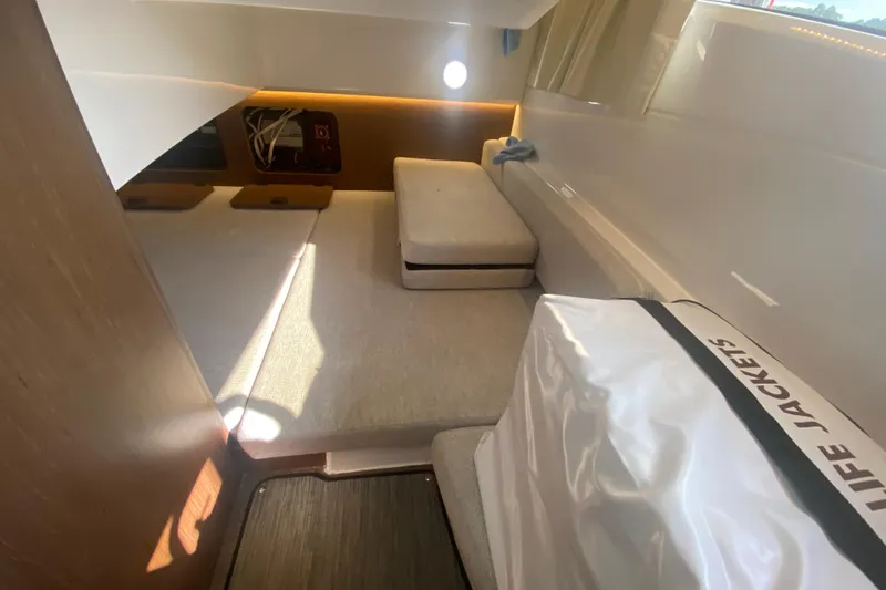 Slide: The Image of Interior cabin of 2024 Jeanneau NC 895 boat with seating and life jackets. - 38