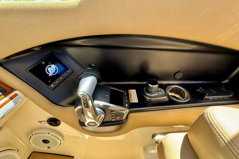 Slide: The Image of 2023 Chris-Craft Calypso 28 boat control panel with joystick and display screen. - 21