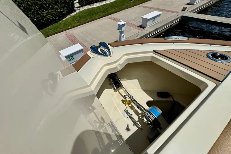 Slide: The Image of 2023 Chris-Craft Calypso 28 boat anchor compartment at dockside. - 26