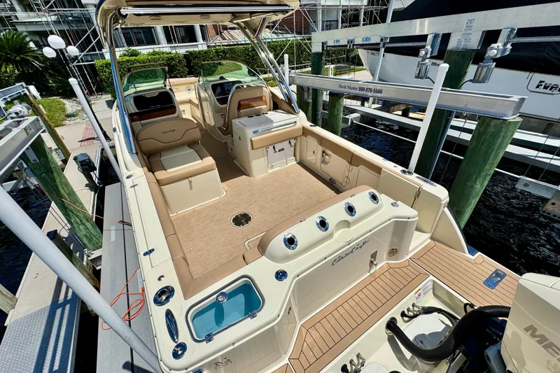 Slide: The Image of 2023 Chris-Craft Calypso 28 boat interior, featuring luxurious seating and modern amenities. - 7
