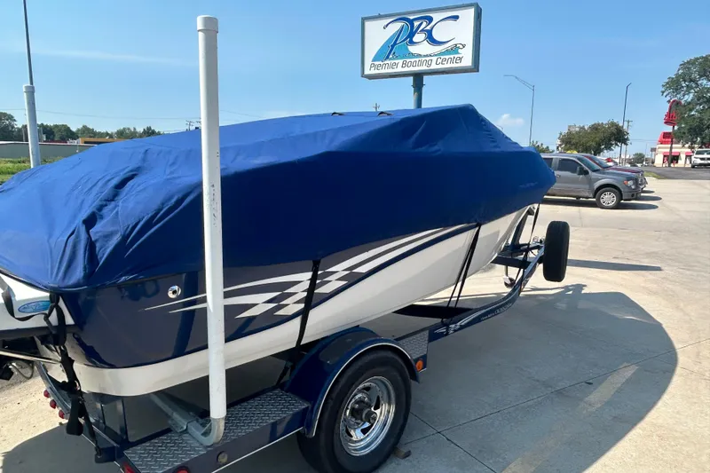 Slide: The Image of 2003 Crownline 192 BR boat with blue cover at Premier Boating Center. - 6