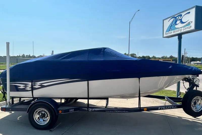 Slide: The Image of 2003 Crownline 192 BR boat covered on trailer at Premier Boating Center. - 8