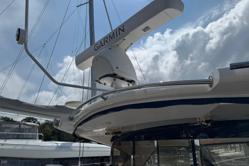 Slide: The Image of 2010 Regal 44 Sport Coupe with Garmin radar under cloudy sky. - 15