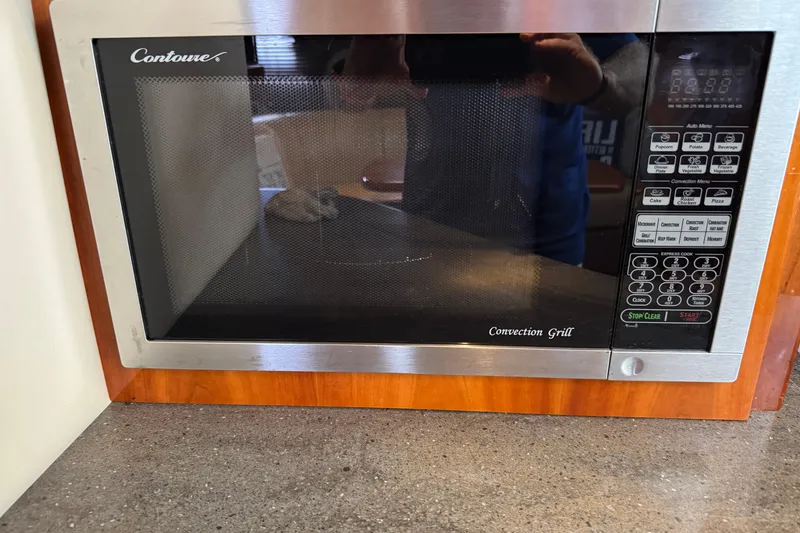 Slide: The Image of Built-in Contoure convection grill microwave in 2010 Regal 44 Sport Coupe kitchen. - 19