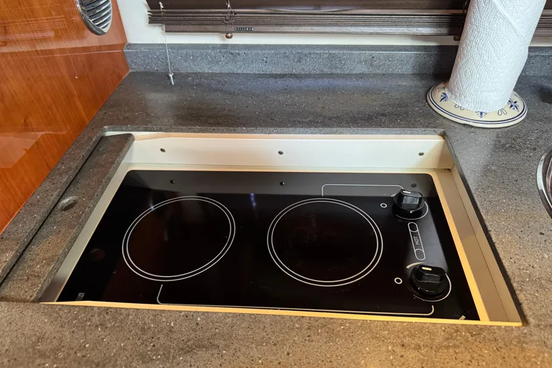 Slide: The Image of Built-in electric stove on 2010 Regal 44 Sport Coupe yacht kitchen counter. - 20