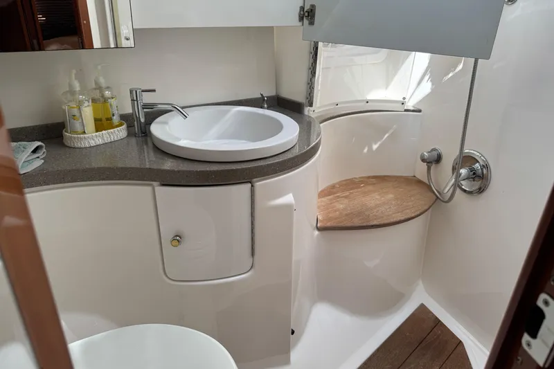 Slide: The Image of Luxurious bathroom in 2010 Regal 44 Sport Coupe yacht with modern fixtures. - 25