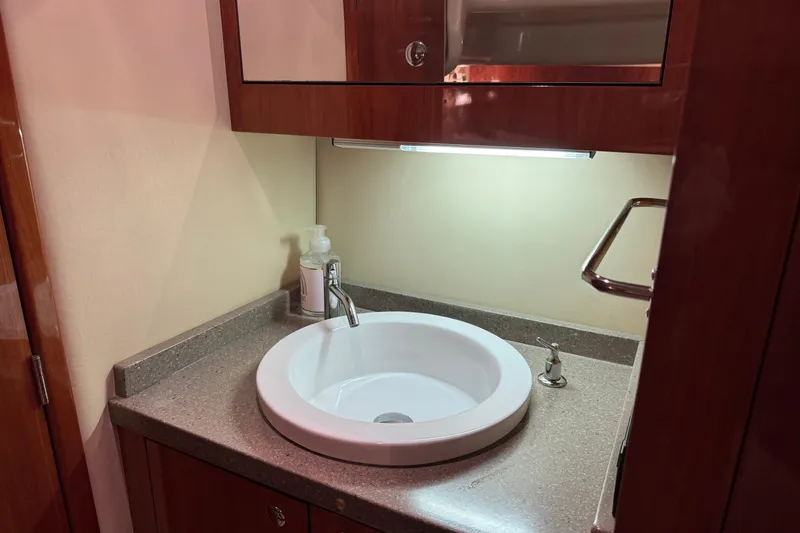 Slide: The Image of Luxurious bathroom sink in 2010 Regal 44 Sport Coupe yacht. - 31
