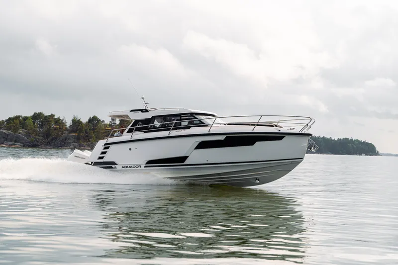 The Image of 2025 Aquador 300 HT cruising on calm waters, showcasing sleek design and modern features. - 0